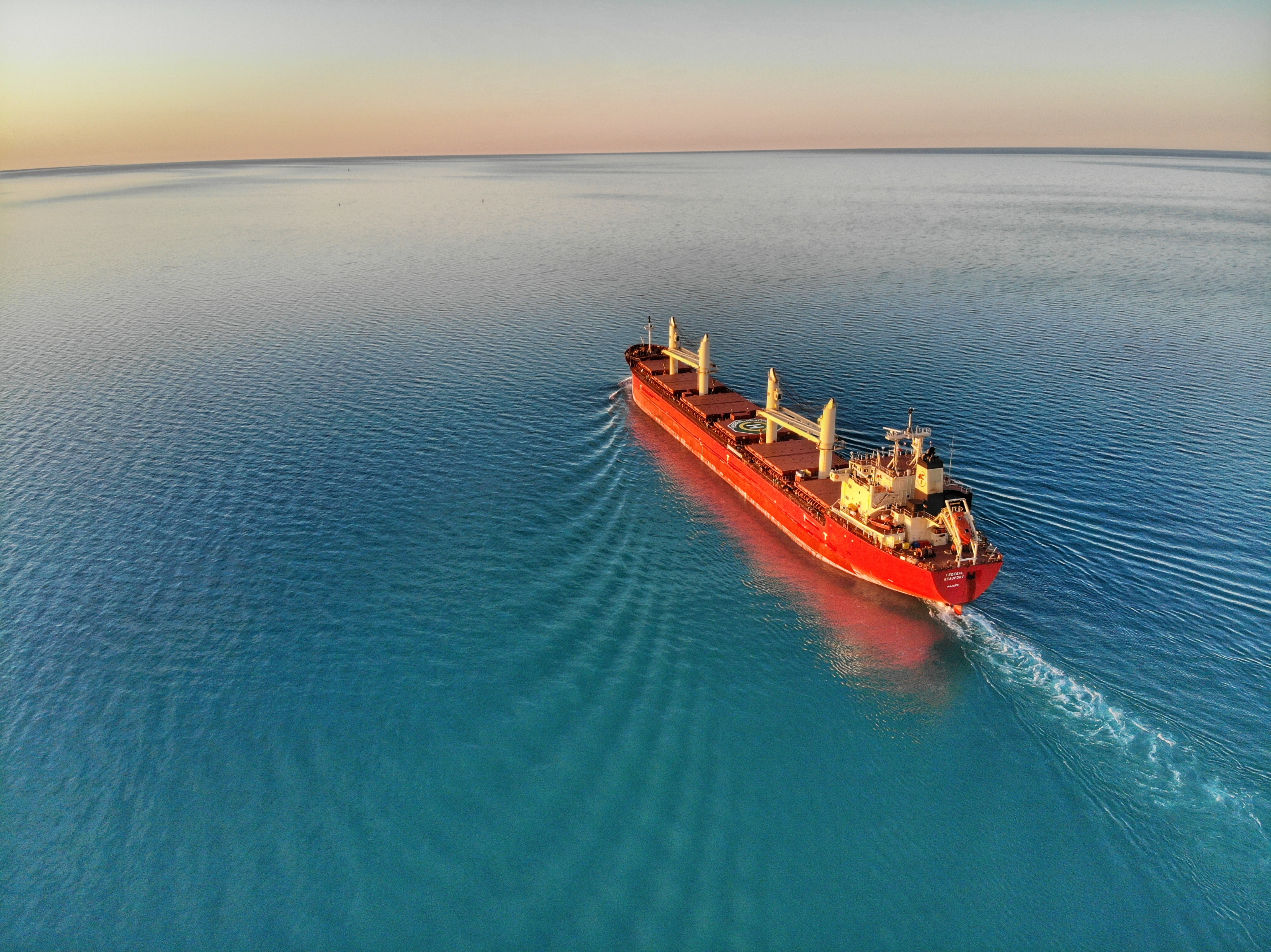 Red Ship on Blue Water