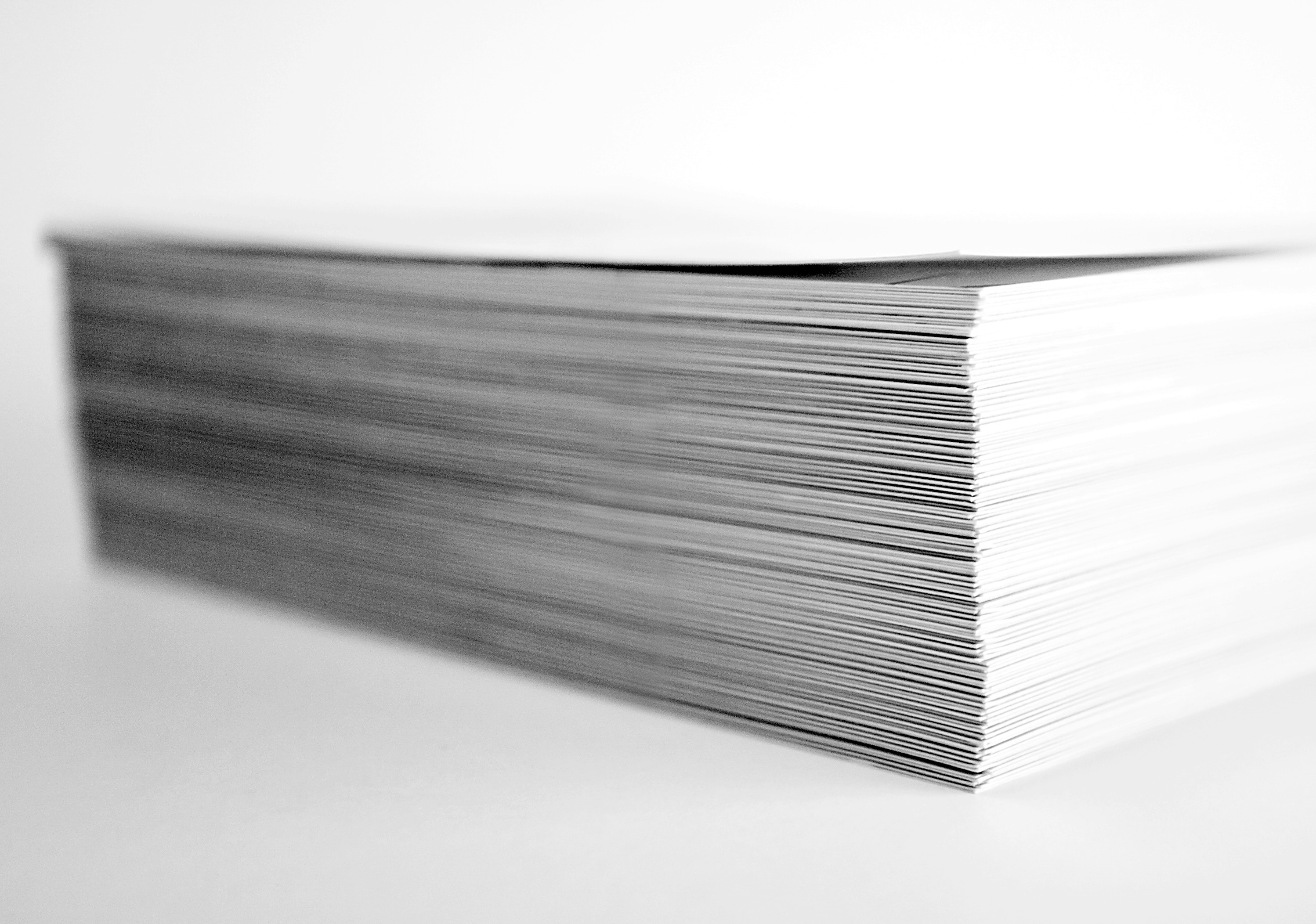 Stack of white paper on white backgrounnd