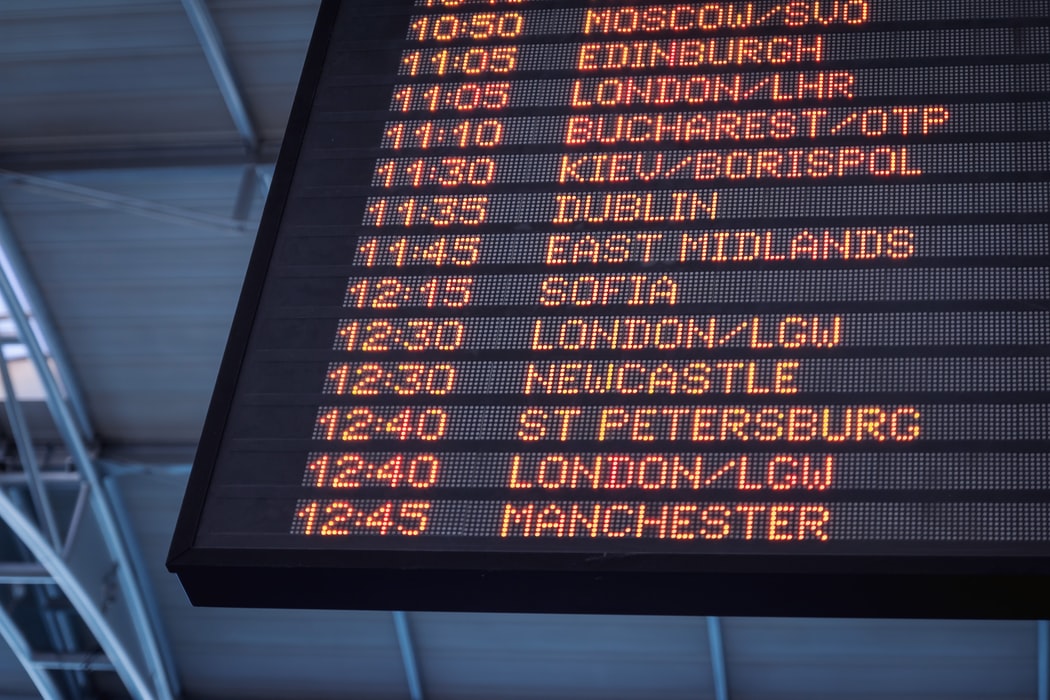 Airport board showing departing flights