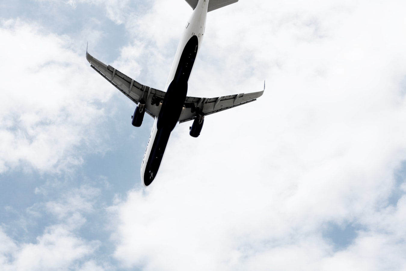 the underside of a flying plane