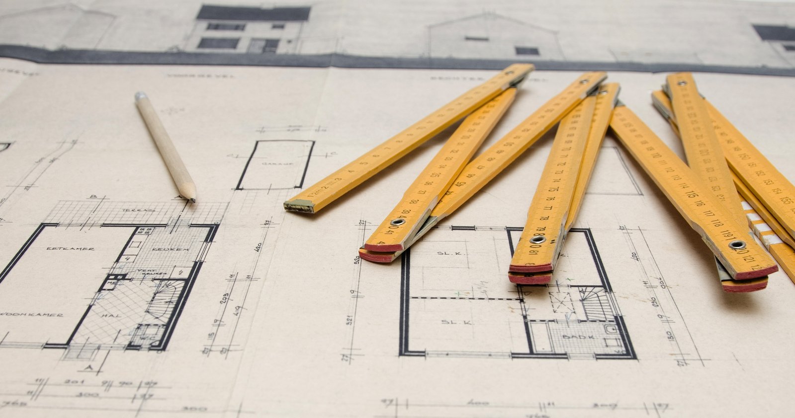 architect blueprints with ruler