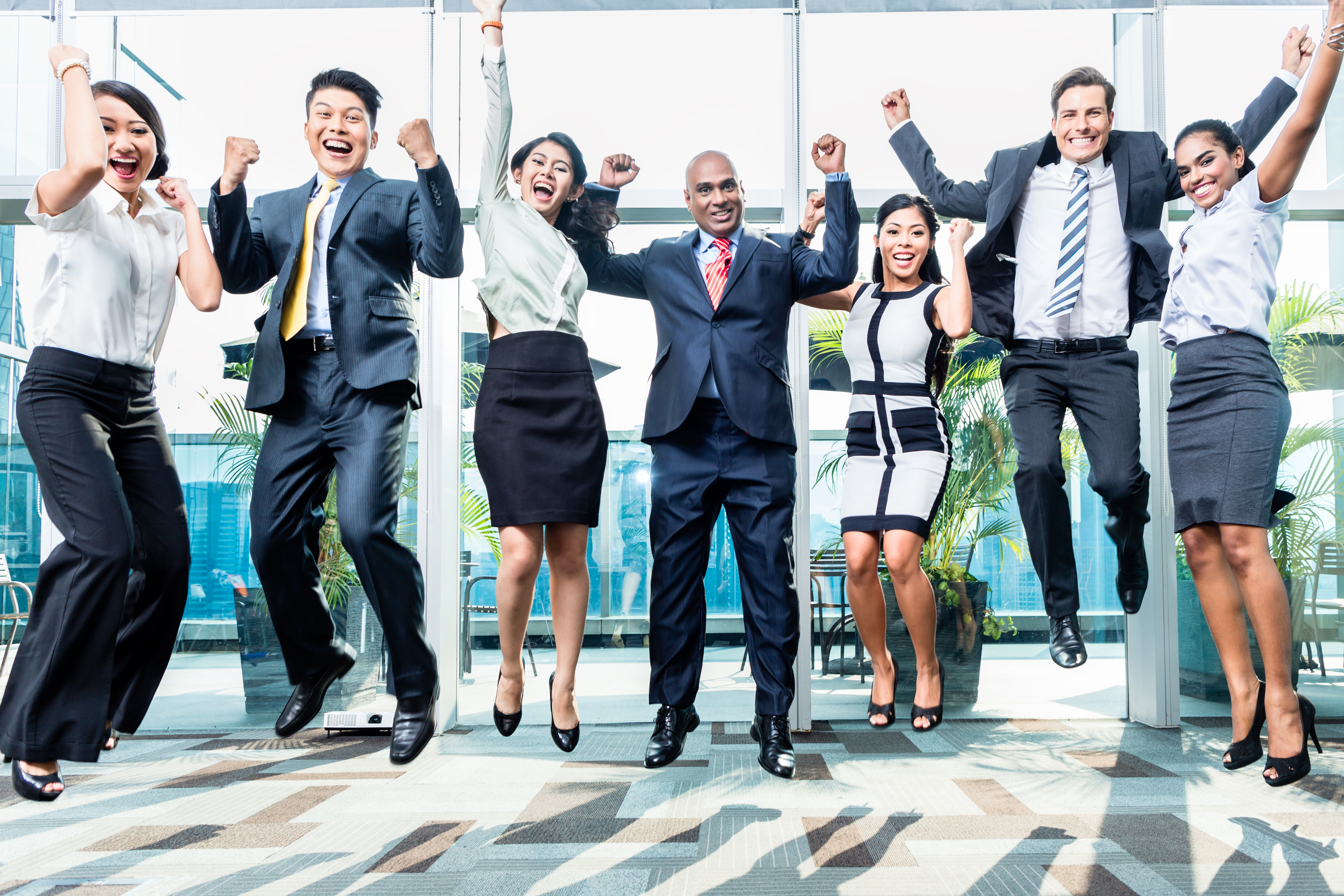 Business People Jumping With Excitement