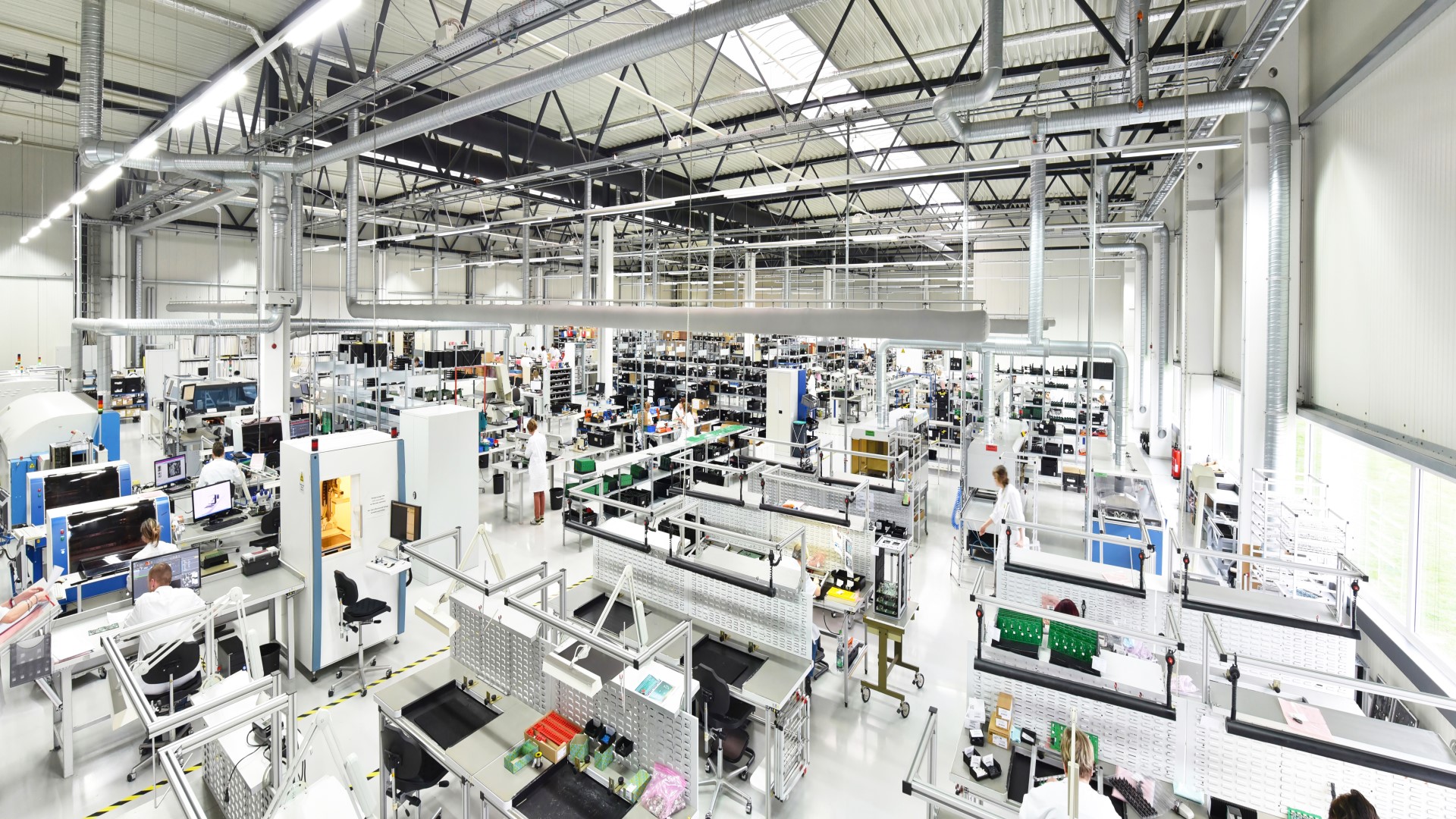 factory floor with machinery and workers