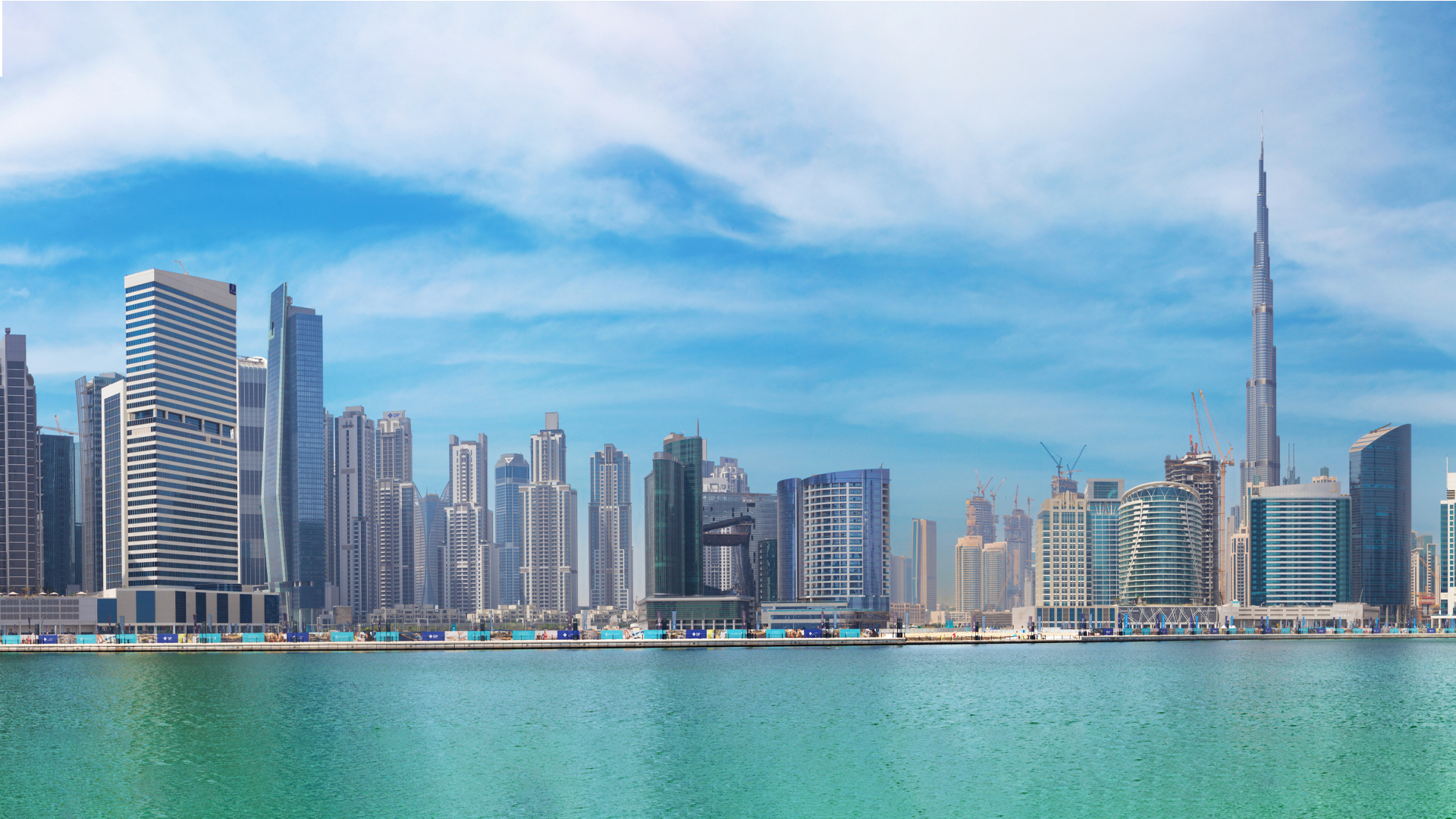 The panorama view with the new Canal and skyscrapers of Dubai Downtown