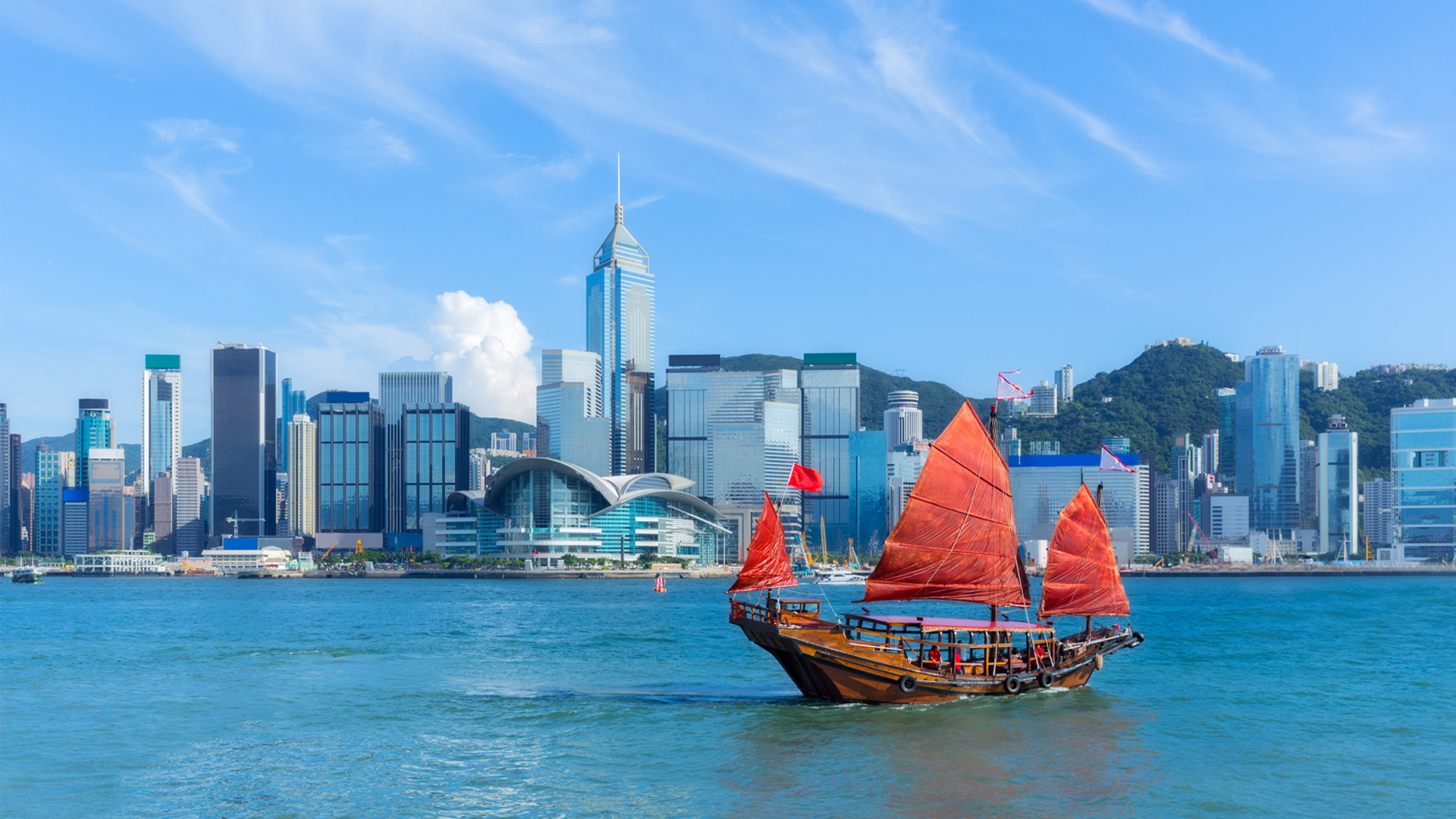 Hong Kong harbour with junk boat on water