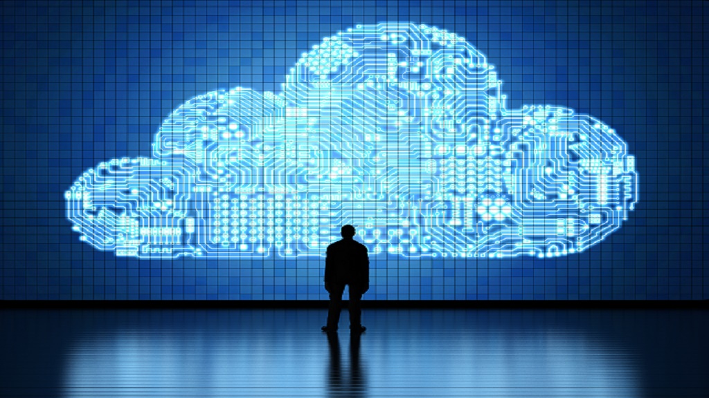 Person standing in front of an Artificial Intelligence Cloud