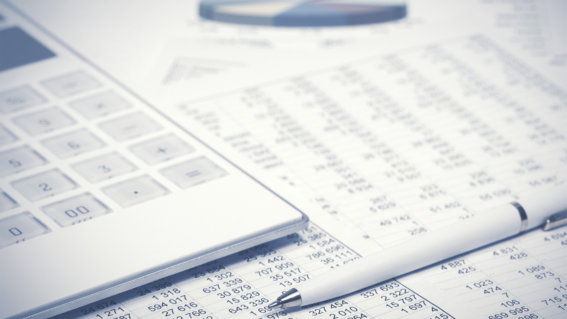Financial accounting pen and calculator on balance sheets Image