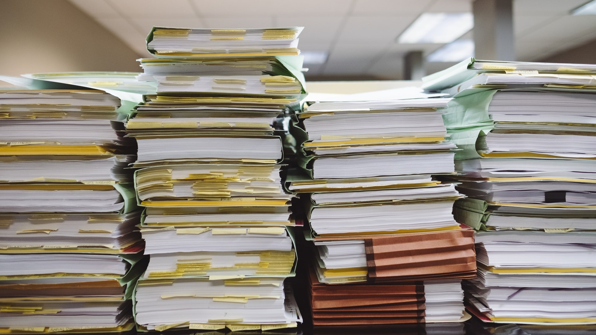 A stack of paperwork and files.