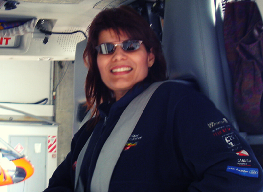 Zephyr International Owner Elizabeth Bielsa-Mitchell sitting in helicopter cockpit