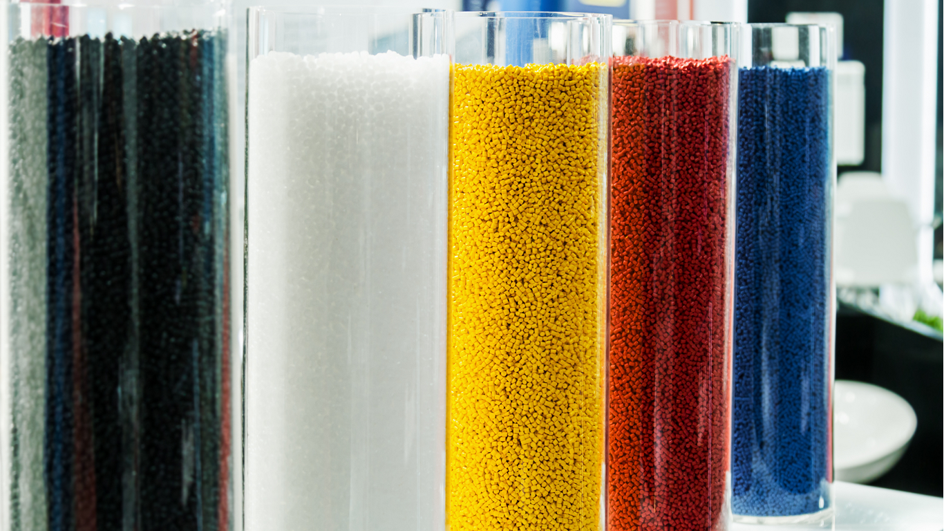 glass jars of colored materials used in additive manufacturing