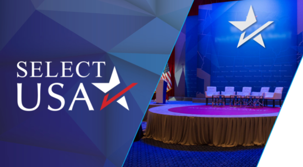 SelectUSA logo with empty chairs on a stage preparing for a panel.
