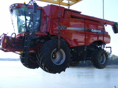 Case IH combine being loaded on a ship