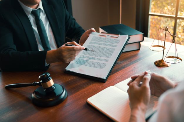 Man walking woman through export legal document