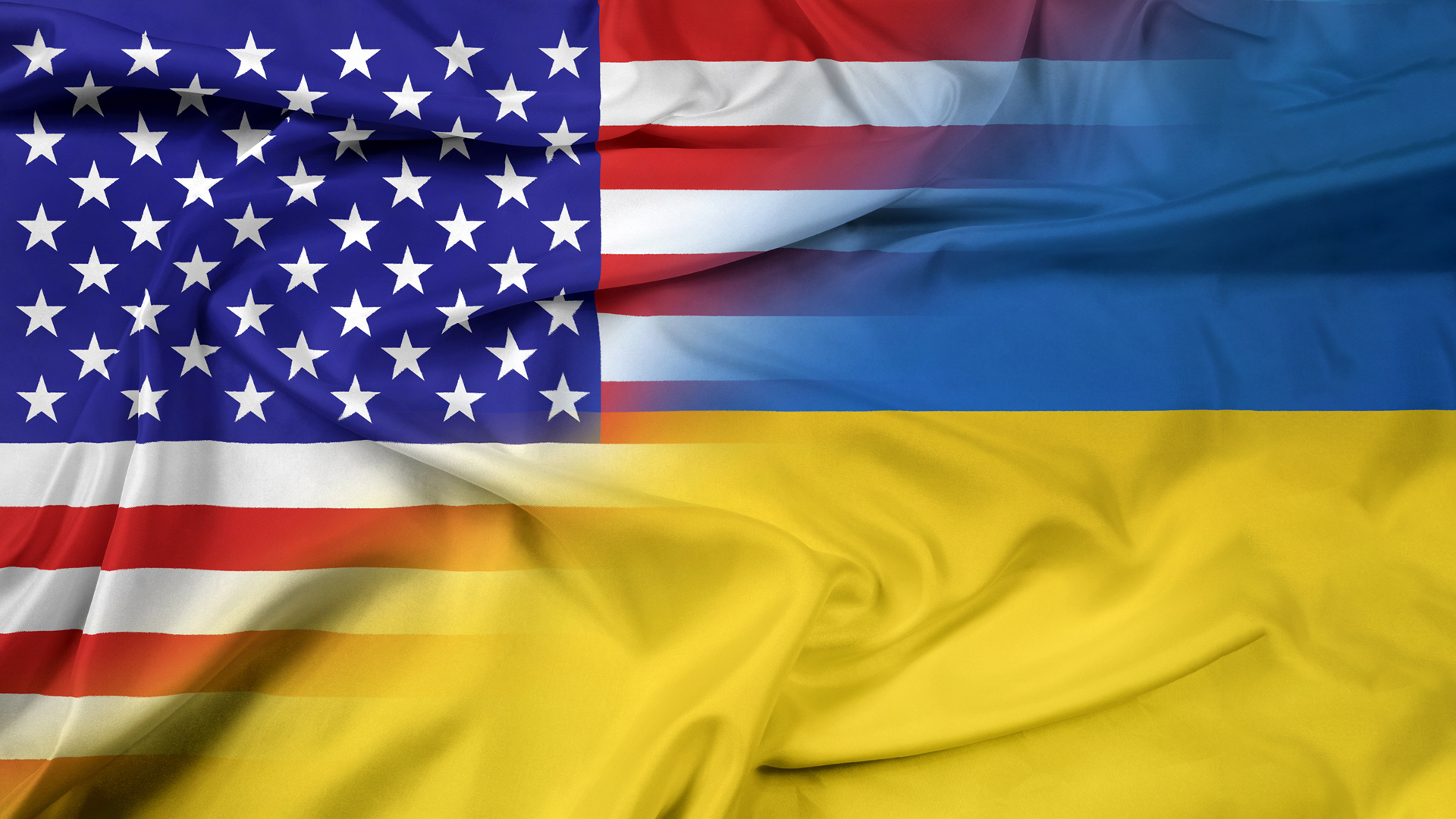 Image of U.S. flag fading into the Ukrainian flag