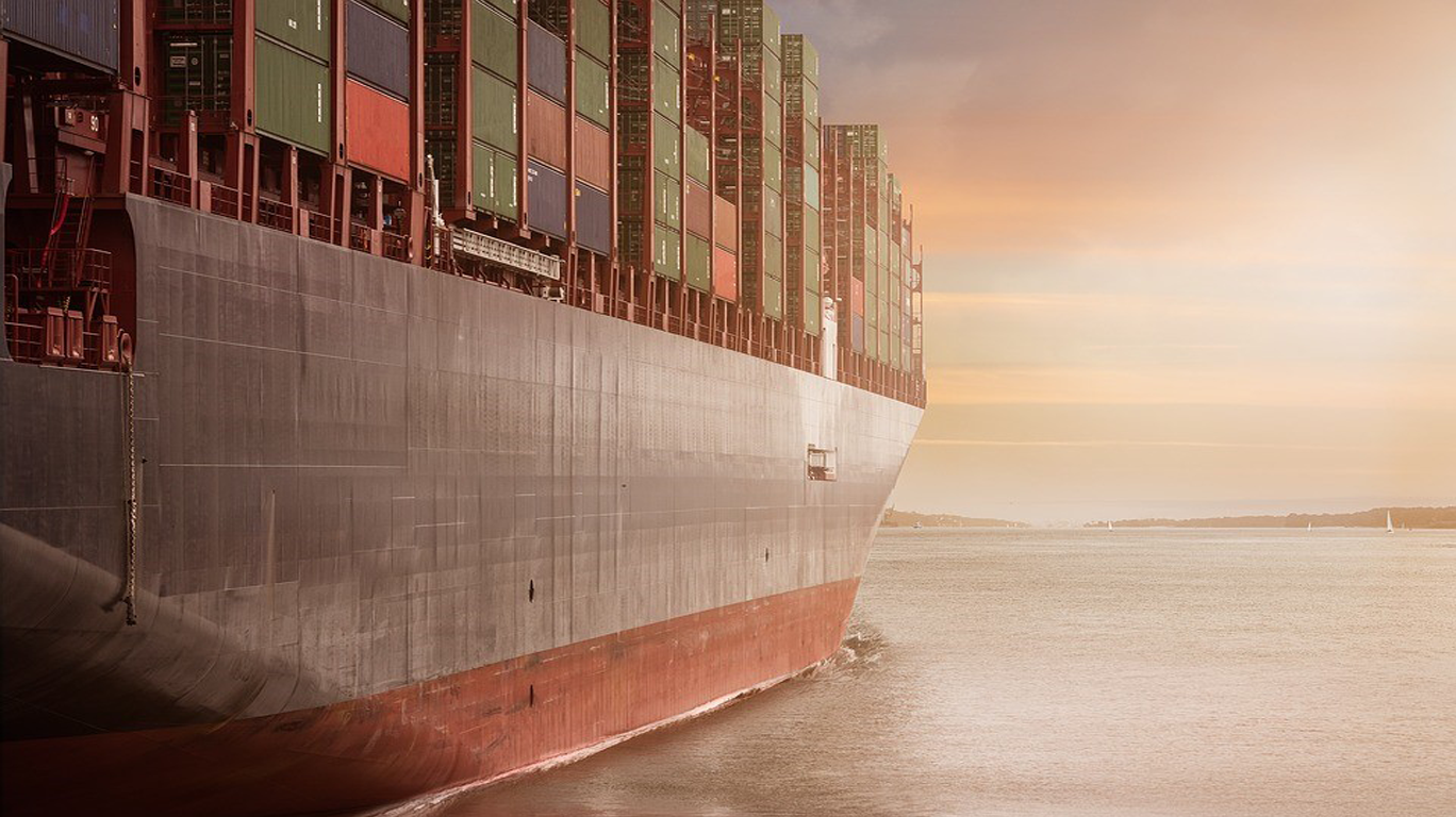 Cargo container ship on silky smooth seas