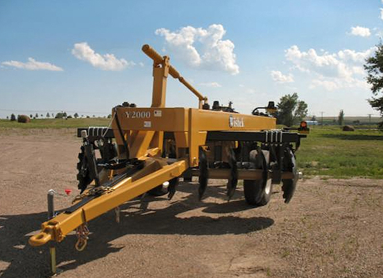 Farming equipment left in a dirt field