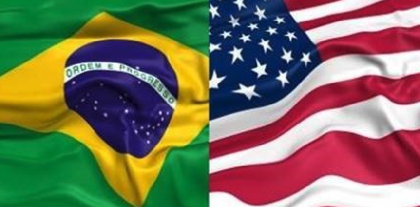 Brazil and U.S. flag together waving