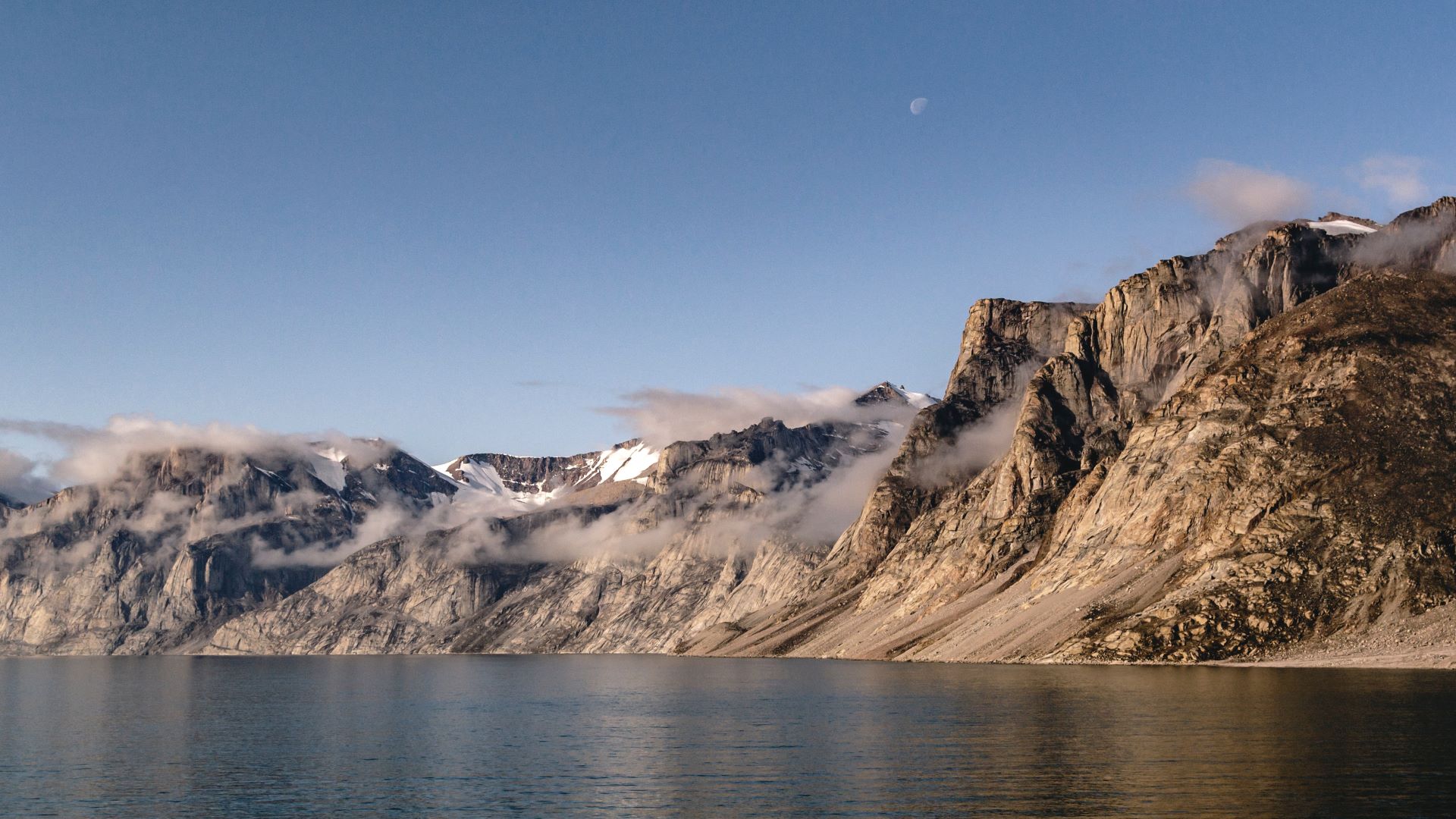 photo of mountain and water