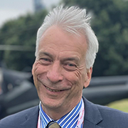 Man with blue shirt and a suit