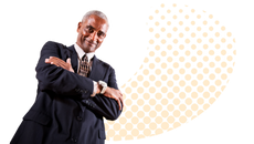 A photograph of a smiling man in a business suit.