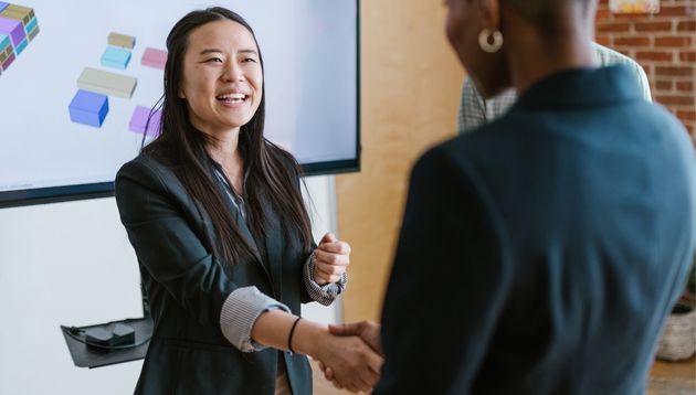 A photograph of business people discussing their products.