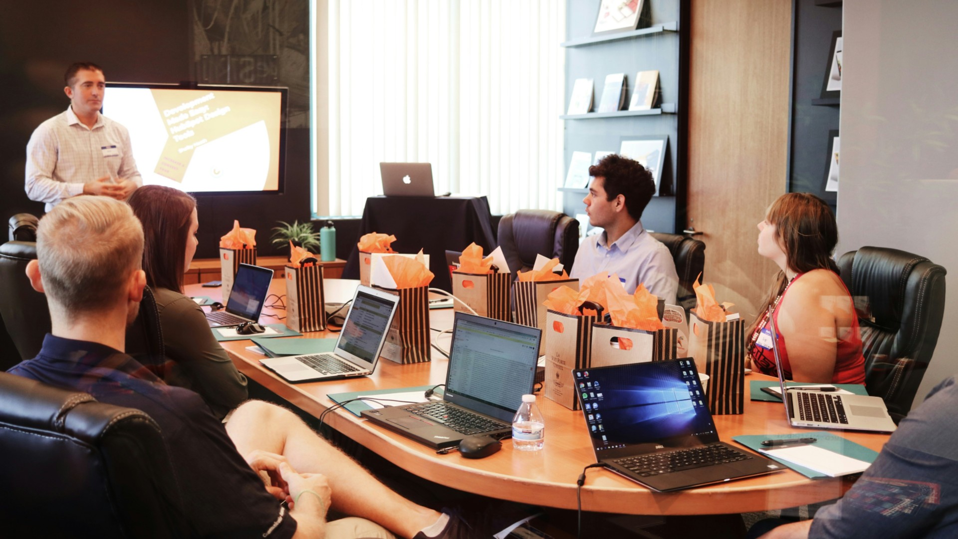 people discussing marketing around a table