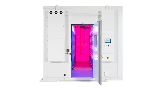An environmental research chamber with a pink-interior glow