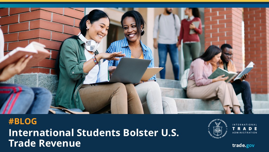 Graphic with the text "#BLOG - International Students Bolster U.S. Trade Revenue" and a picture of two female students sitting next to each other smiling.