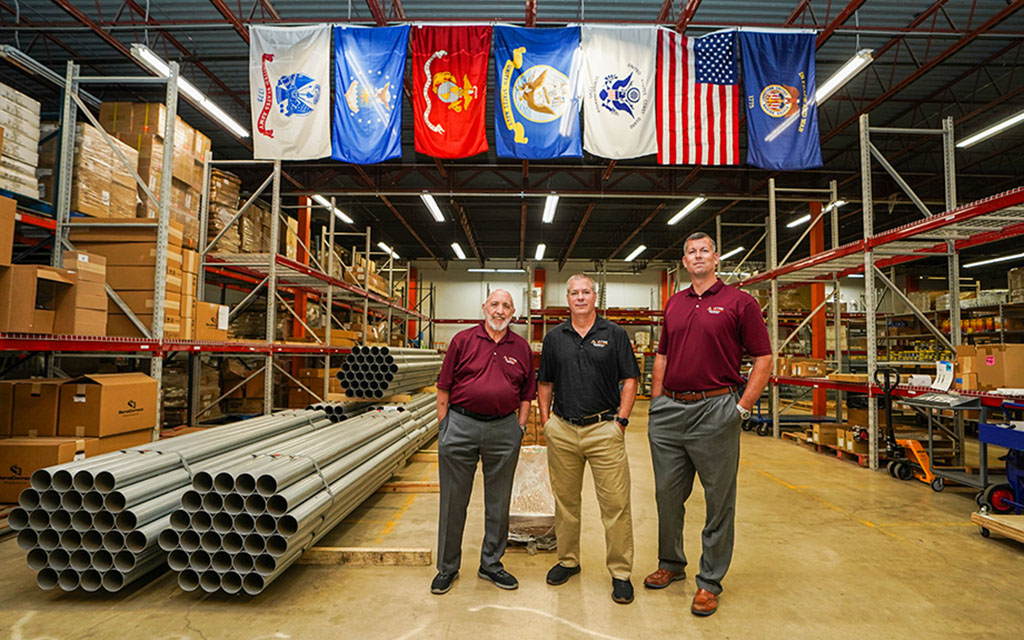 Atek factory floor with owners