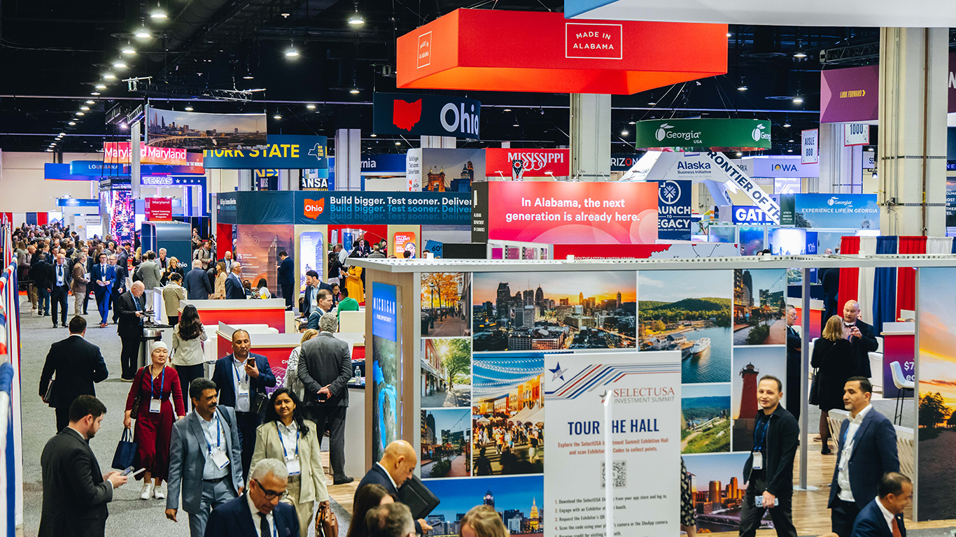 Booths and people are seen in the Exhibition Hall at the 2026 SelectUSA Investment Summit.