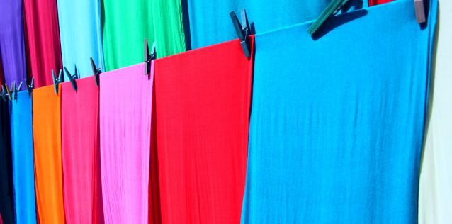 brightly colored cloth hanging on lines