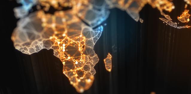 Africa continent surrounded by black lit up with lights