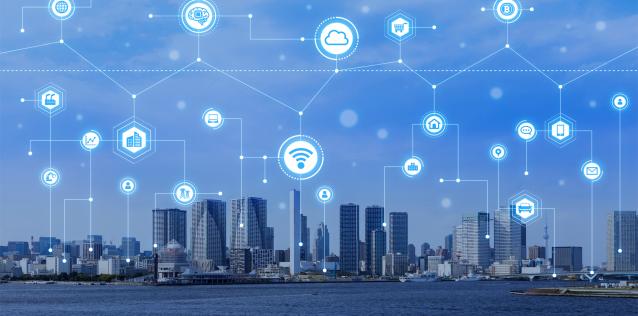image of a city with blue sky and various cyber related icons