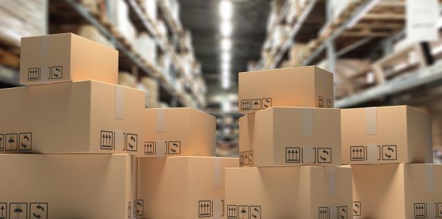 Cardboard_Boxes on Blur Storage Warehouse Shelves Background Image