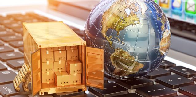 laptop with globe and packages