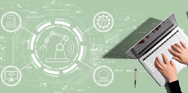 Computer on a light green mechanical drawing