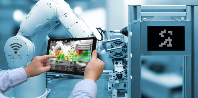 Robotic arm with control tablet in operator's hand