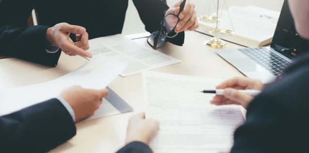 Law, advice and Legal services concept. Lawyer and attorney having team meeting at law firm.