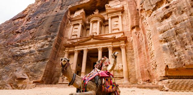 Spectacular view of two beautiful camels in front of Al Khazneh at Petra. Petra is a historical and archaeological city in southern Jordan