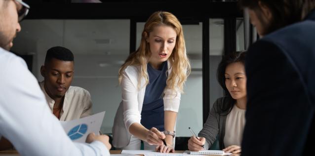 Young businesswoman explaining research results in graphs to colleagues Image for Hero Box