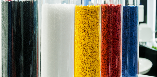 glass jars of colored materials used in additive manufacturing