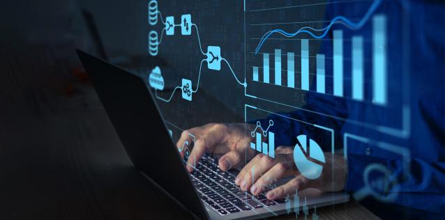 Man hands typing on a laptop keyboard with light blue IT graphics crossing the screen