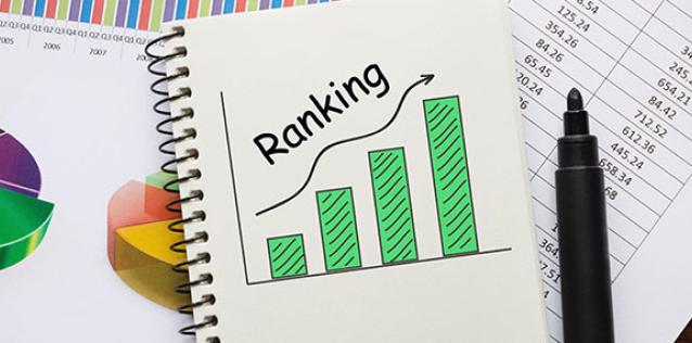 A drawing in a spiral bound notebook of a graph with four consecutively taller vertical bars, a growing trend line, and the word "Ranking" written across the top.