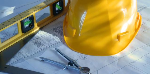 Construction hat next leveler tool and business building plan