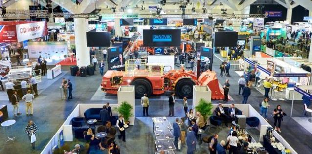 People on a trade show floor. 