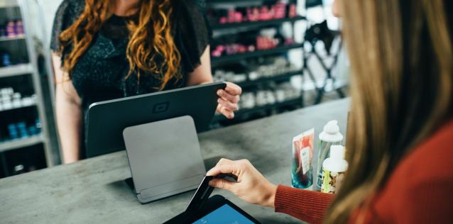 Women Processing Payment Point-of-Sale