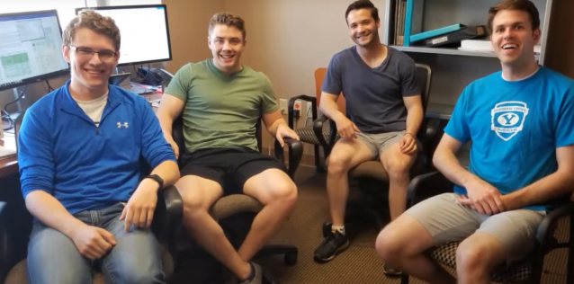 Four interns sitting around a computer 