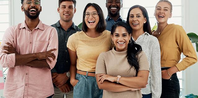 Group of businesspeople standing together after a successful discussion in the office