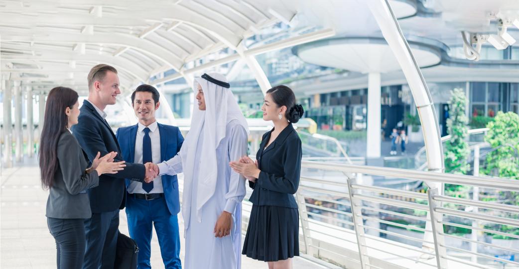 Multi-ethnic businessman standing and shaking hand in the city for successful in Business Cooperation. 