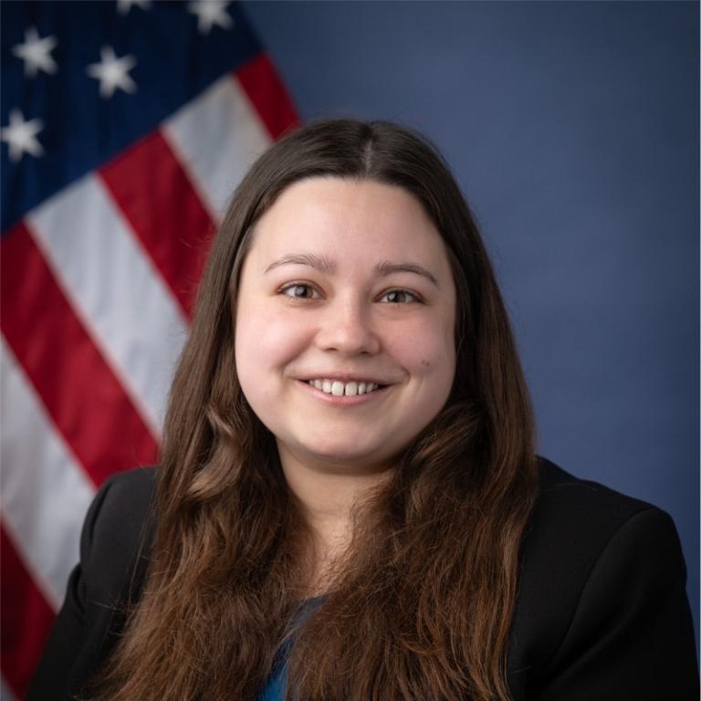 Casey Fitzpatrick in front of a U.S. flag